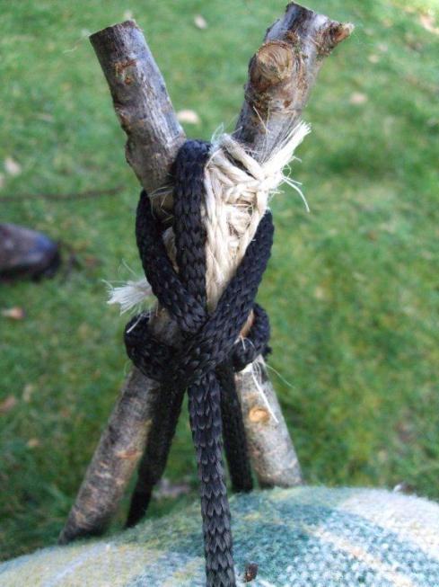 lark's head knot also tensions the packing strap that attaches to the top of the frame